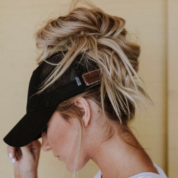 messy bun with baseball cap